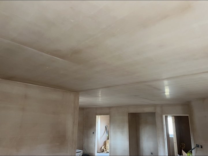 Smooth plaster finish across a large ceiling and walls