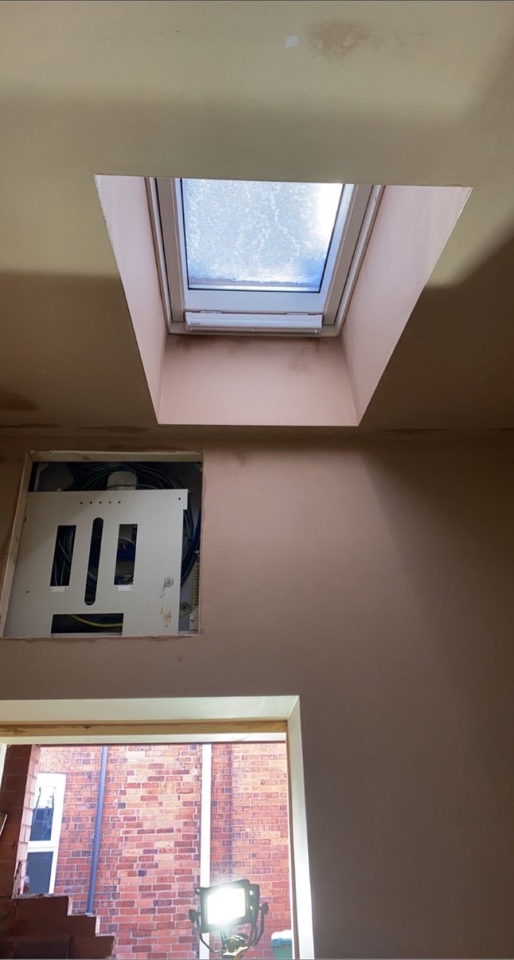 Plaster finish surrounding a roof window